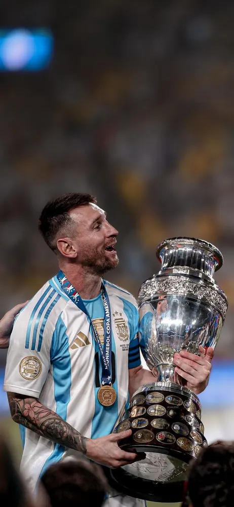 Messi celebrating with the Copa América trophy in 2024