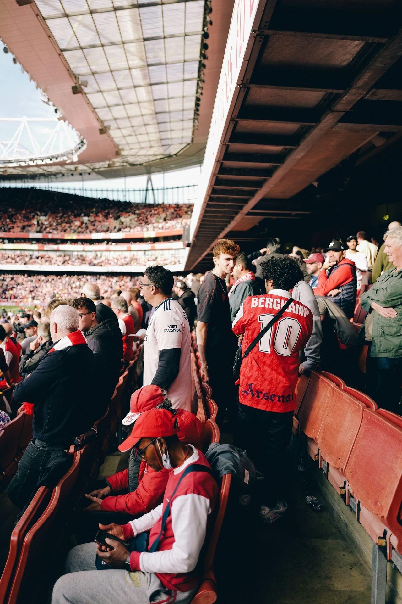 Supporters packed into a stand before kick-off, many in 1990s club shirts
