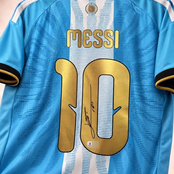 Back of the Argentina shirt with gold MESSI 10, signed in black marker across the 1 and 0